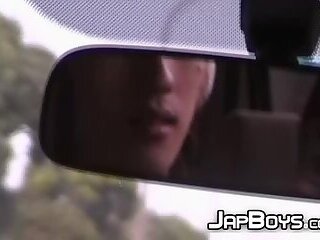 Japanese twinks kissing passionately in the back of the car